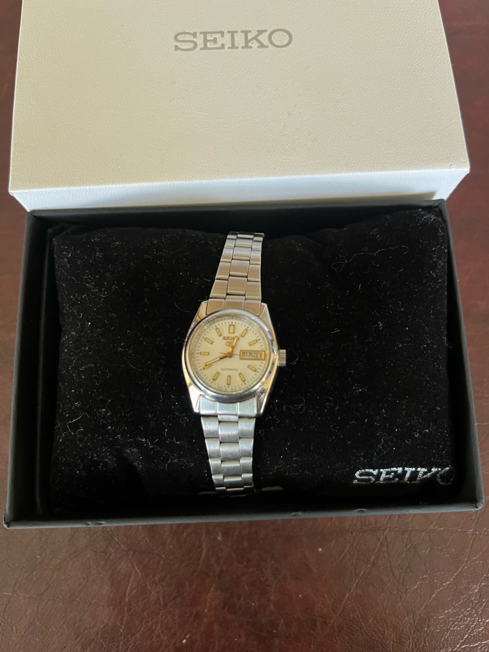 Seiko 5 Silver Watch with Cream Dial and Gold Accents